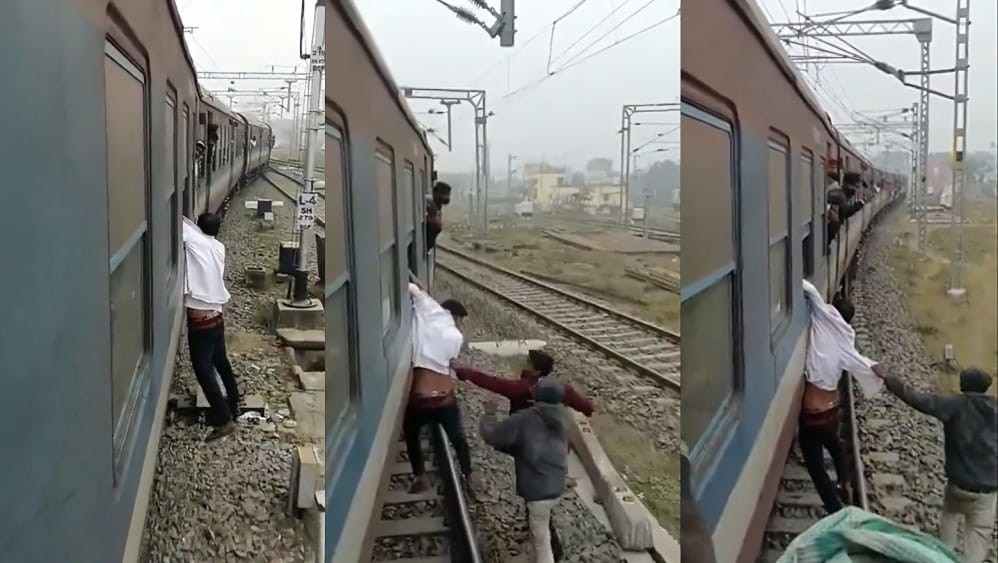Mugger dangles from moving train in India after failed mobile theft