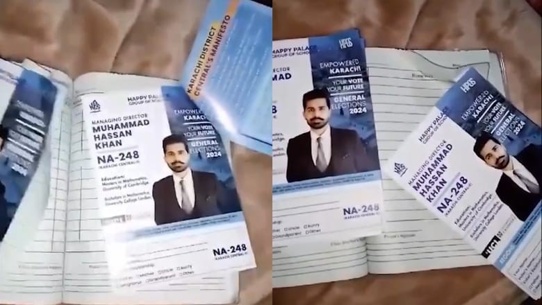 PPP candidate slips his election campaign posters into students' notebooks in Karachi