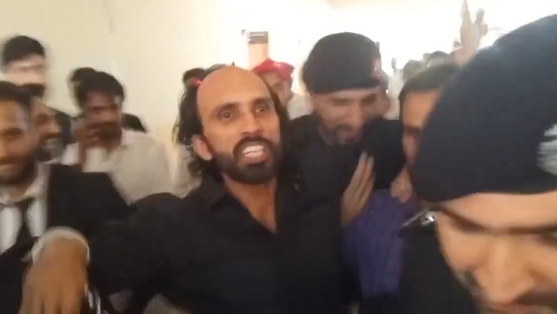 Handcuffed Ahmed Farhad recites 'revolutionary couplet' upon reaching court