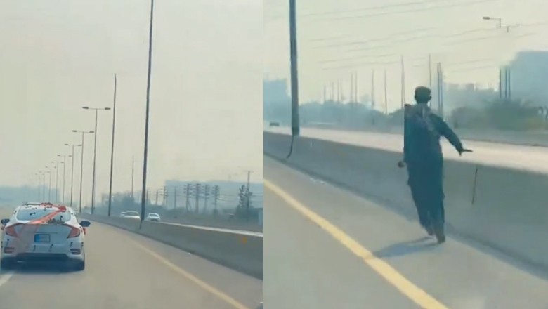 Passersby collect cash showered by wedding car on motorway