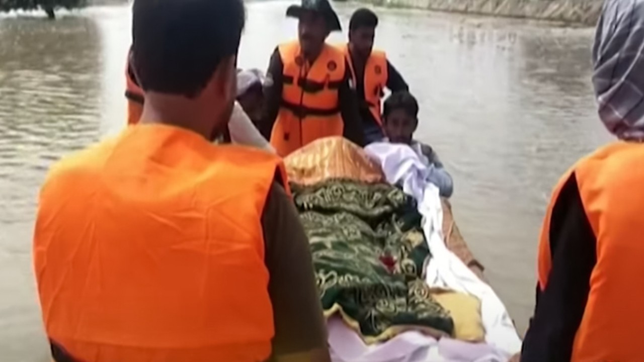 Funeral carried by boat in Bahawalpur as floodwaters cut off roads